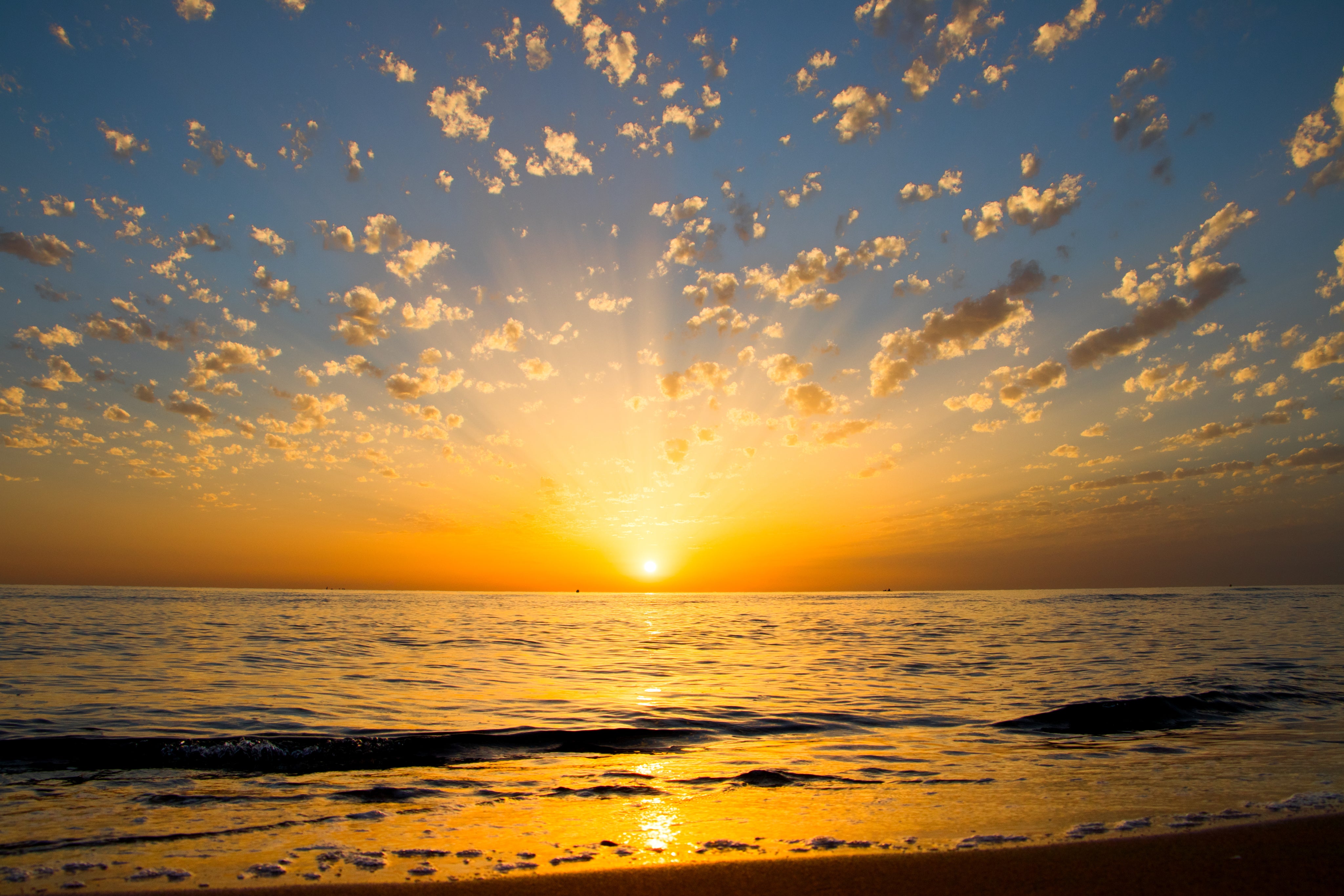 yellow-sunrise-reflections-over-the-water.jpg
